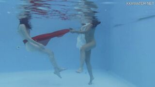Girlfriends enjoy swimming naked together