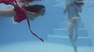 Girlfriends enjoy swimming naked together