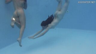 Girlfriends enjoy swimming naked together
