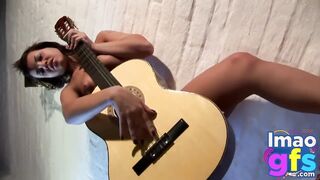 Hot Paul showing her medium tits and pussy with guitar