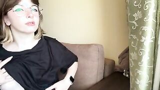 Attractive brunette in a t-shirt shows off her lush tits