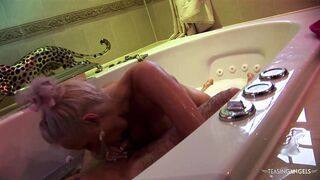 Busty blonde girls playing with a hard dick in the bathtub