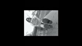 Nurse vicki models in her black and whot hogwarts outfit and spiked boots