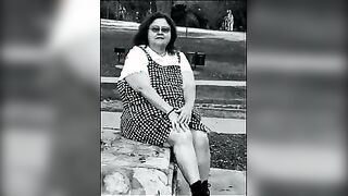 Nurse vicki models in her black and whot hogwarts outfit and spiked boots