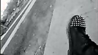 Nurse vicki models in her black and whot hogwarts outfit and spiked boots