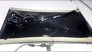 latex vacbed orgasm with vibrator and e-stim