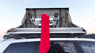 Mountain girl shows off rooftop tent set up and light up butt plug