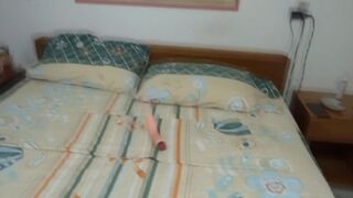 At the beach, stepmother, lacking a cock, enjoys her two huge dildos