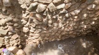 My neighbors are taking a shower on the patio. I must go there to see it up close