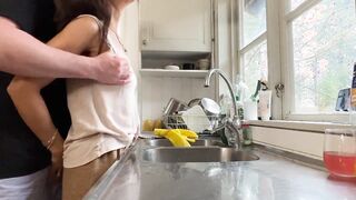Horny wife gets fucked in the kitchen while doing the dishes