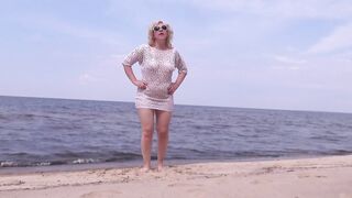 Nimble mature mommy has fun with young guys on the beach 2