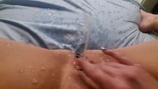 Fingering pussy, huge squirt leaves puddle in amateur bed